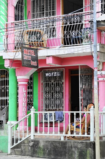 San Juan del Sur, Nicaragua, A colourful hostel building with wrought iron balconies in an urban tropical area, Central America, Central America -, Central America