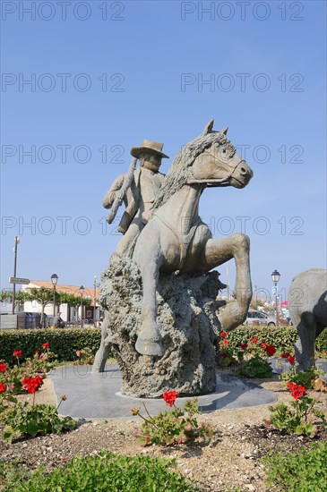 Statue of a drover with Camargue horse, Les Saintes-Maries-de-la-Mer, Camargue, Bouches-du-Rhone, Provence-Alpes-Cote d'Azur, South of France, France, Europe