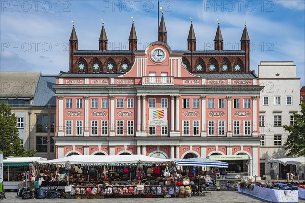 Colourful market scene on the Neuer Markt in front of the historic town hall in the old town of Rostock, Mecklenburg-Western Pomerania, Germany, 5 August 2019, for editorial use only, Europe