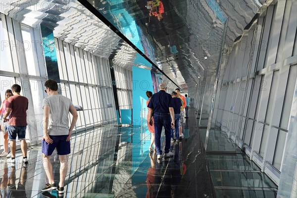 Observation deck, The Bottle Opener at 492 metres, visitors experience a unique perspective on a reflective glass floor of an observation deck, Shanghai, China, Asia