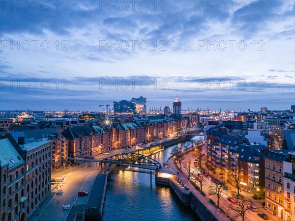Aerial view of Speicherstadt Hamburg and the Elbe Philharmonic Hall with customs canal at blue hour, Hamburg, Germany, Europe