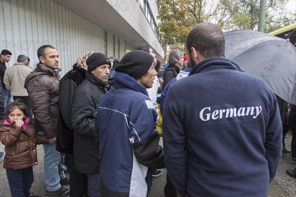 Syrian refugees wait for their registration in cold and wet weather at the Berlin State Office for Health and Social Affairs, 15 October 2015, Berlin, Berlin, Germany, Europe