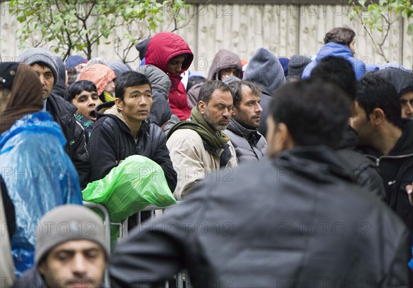Syrian refugees wait for their registration in cold and wet weather at the Berlin State Office for Health and Social Affairs, 20 October 2015, Berlin, Berlin, Germany, Europe