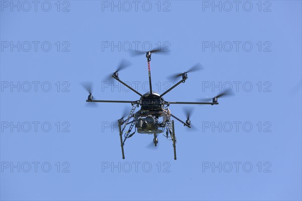 Drone with eight propellers, octocopter, in flight with camera for film and photo shoots, 07.06.2015, Thale, Saxony-Anhalt, Germany, Europe