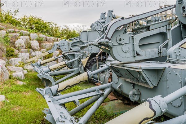 Rear view of military tanks in camouflage paint on display in public park in Nonsan, South Korea, Asia