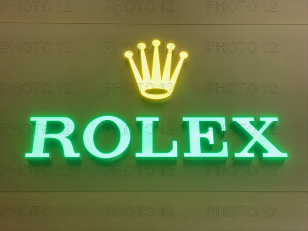 Rolex Illuminated on a Wall in Switzerland