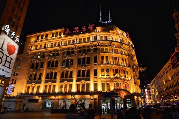 Shanghai by night, China, Asia, Illuminated historical building at night in a busy city street, Shanghai, Asia