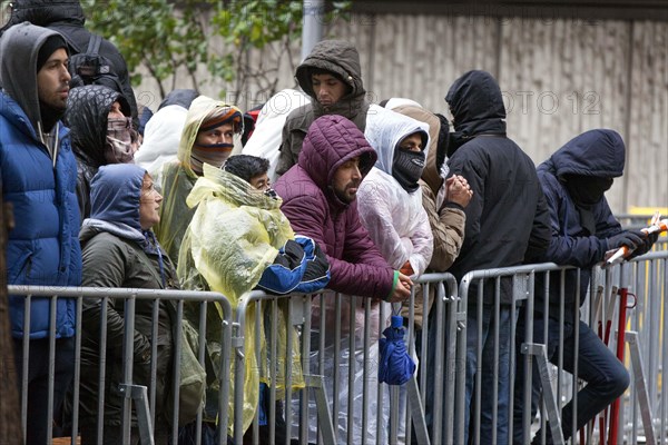 Syrian refugees wait for their registration in cold and wet weather at the Berlin State Office for Health and Social Affairs, 15 October 2015, Berlin, Berlin, Germany, Europe