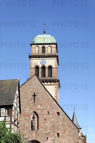 Kaysersberg, Alsace Wine Route, Alsace, Departement Haut-Rhin, France, Europe, Church tower with copper roof and clock in front of a clear blue sky, Europe