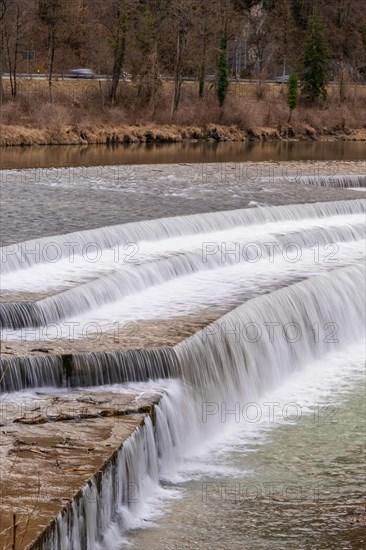 Gentle waterfall over stepped stone formation in natural surroundings, Bad Reichenhall, Bavaria, Germany, Europe