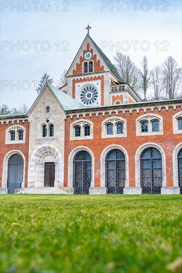 Historic church with Gothic style and brick facade under a cloudy sky, Bad Reichenhall, Alte saltworks, Bavaria, Germany, Europe