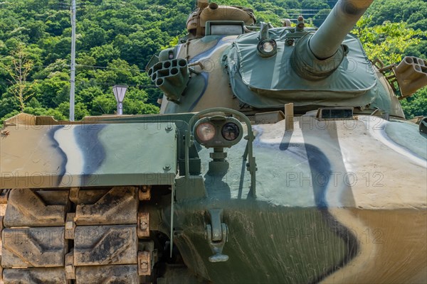 Front view of camouflaged tank used in Korean war on display in public park in Nonsan, South Korea, Asia