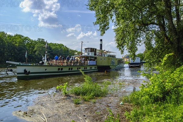 The historic paddle steamer KURORT RATHEN has docked at the steamer landing stage in Pillnitz, Dresden, Saxony, Germany, Europe