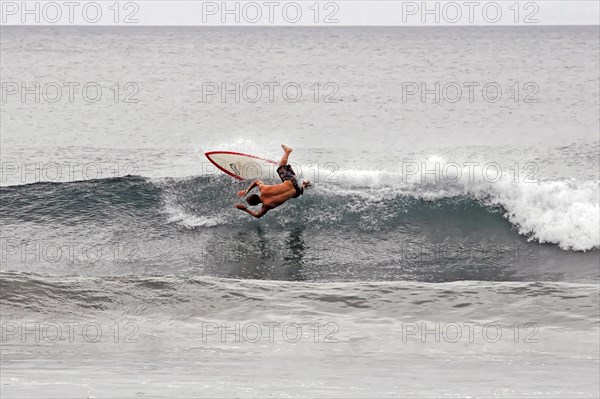 San Juan del Sur, Nicaragua, A surfer performs an acrobatic jump on a wave, Central America, Central America -, Central America