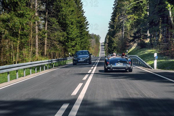 Country road near Boerwang with an old MG sports car, Allgaeu, Swabia, Bavaria, Germany, Europe