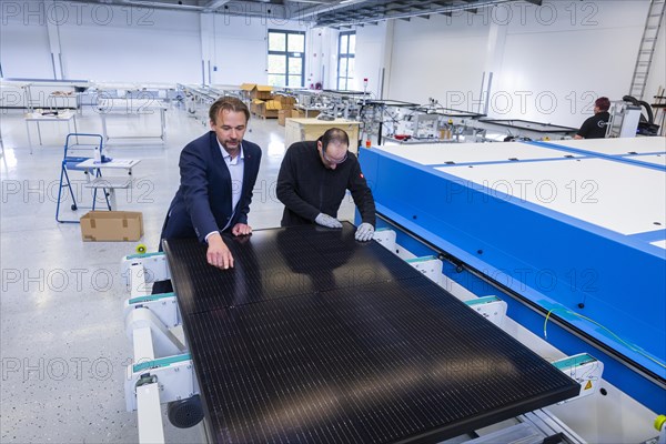 Sunmaxx PVT is a new innovative developer of photovoltaic thermal solar modules. The Fraunhofer ISE has confirmed an overall efficiency of 80% for the PX-1 premium module. The innovation is the combination of photovoltaics and solar thermal energy in one element. Dr Jiri Springer Chief Technology Officer (CTO) and employee Emad Sidhorn at a PVT module, Ottendorf-Okrilla, Saxony, Germany, Europe