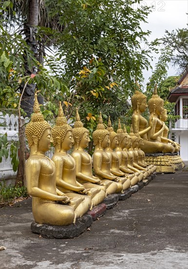 Row of gilded Buddha statues, Wat That Luang, Luang Prabang, Laos, Asia