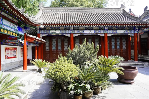 Chongqing, Chongqing Province, China, Asia, Traditional Chinese building complex with plants in the courtyard, Asia