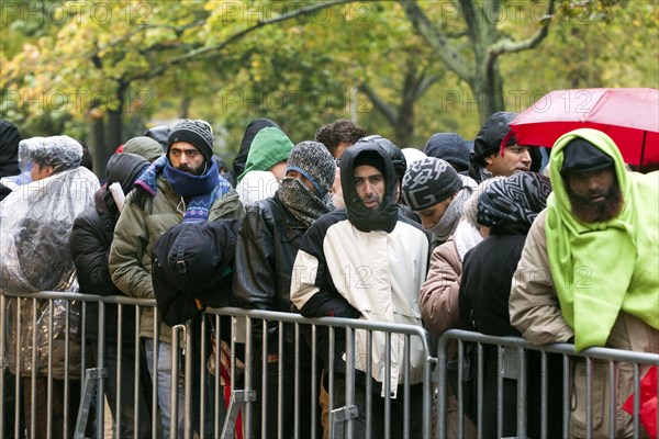 Syrian refugees wait for their registration in cold and wet weather at the Berlin State Office for Health and Social Affairs, 15 October 2015, Berlin, Berlin, Germany, Europe