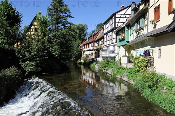 Kaysersberg, Alsace Wine Route, Alsace, Departement Haut-Rhin, France, Europe, An idyllic river flows past traditional half-timbered houses, Europe
