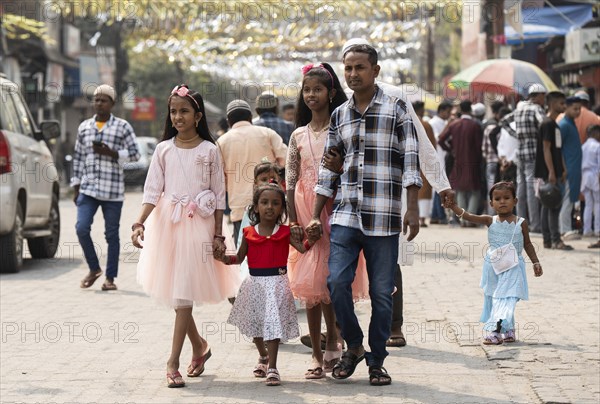 GUWAHATI, INDIA, APRIL 11: Muslim people with children walk towards an Eidgah to perform Eid Al-Fitr prayer in Guwahati, India on April 11, 2024. Muslims around the world are celebrating the Eid al-Fitr holiday, which marks the end of the fasting month of Ramadan