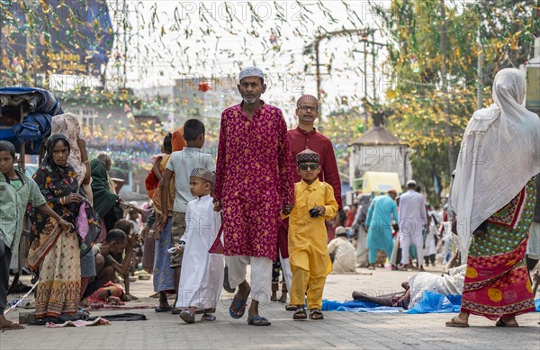 GUWAHATI, INDIA, APRIL 11: Muslim people with children walk towards an Eidgah to perform Eid Al-Fitr prayer in Guwahati, India on April 11, 2024. Muslims around the world are celebrating the Eid al-Fitr holiday, which marks the end of the fasting month of Ramadan