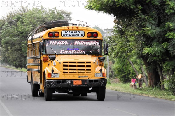 On the road near Rivas, Colourful bus driving on a road, typical means of transport in Central America, Nicaragua, Central America, Central America