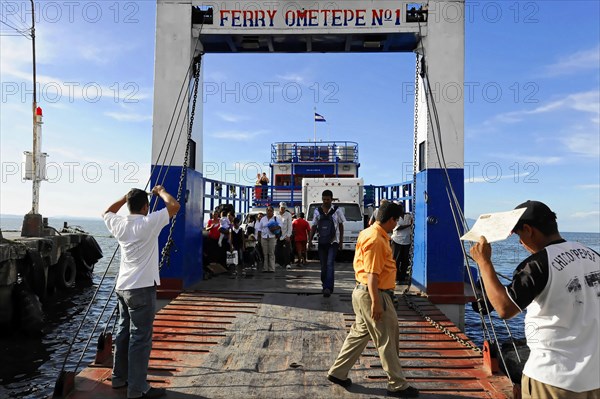 Lake Nicaragua, people boarding a ferry via a jetty, on the shore with clear sky, Nicaragua, Central America, Central America