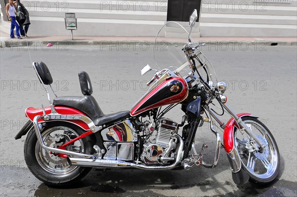 Leon, Nicaragua, A shiny red motorbike with chrome details, parked on a street, Central America, Central America