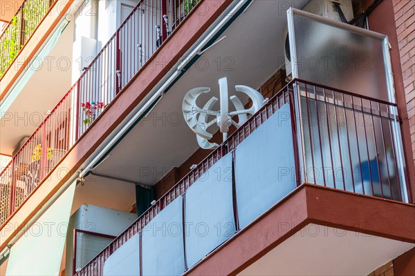 Balcony power plant and mini wind turbine on a balcony of a high-rise building in Barcelona, Spain, Europe