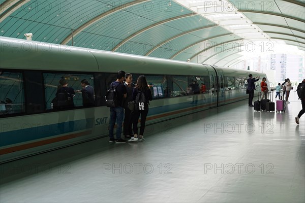 Shanghai Transrapid Maglev Shanghai Maglev Train Station Station, Shanghai, China, Asia, Passengers waiting next to a train on a modern platform with glass walls, Asia