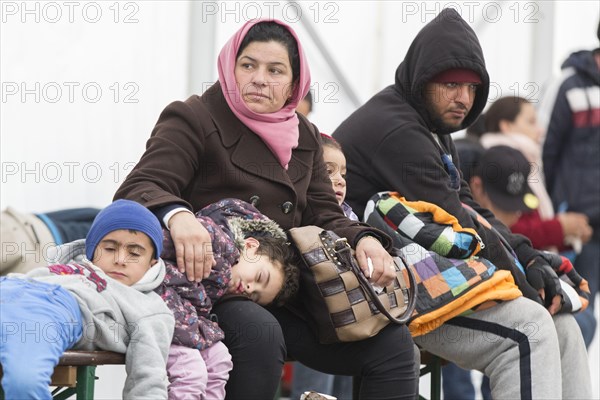 A Syrian refugee family and their children wait in a tent at the Berlin State Office for Health and Social Affairs for their registration, 15 October 2015, Berlin, Berlin, Germany, Europe