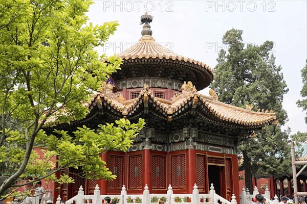 China, Beijing, Forbidden City, UNESCO World Heritage Site, Round red pavilion with rich decoration and surrounded by green vegetation, Forbidden City (Palace Museum) in Beijing, China, Asia