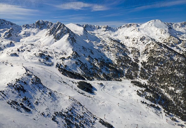 View of several mountain peaks and snowy landscapes with some trees visible, Grau Roig, Encamp, Andorra, Pyrenees, Europe
