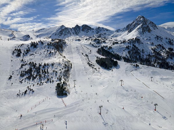 Snow-covered slopes with skiers and lifts in the sunny mountain area, Grau Roig, Encamp, Andorra, Pyrenees, Europe