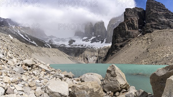 Meltwater lake in front of the Paine Horns, Base of Torres del Paine Hike, Torres de Paine, Magallanes and Chilean Antarctica, Chile, South America