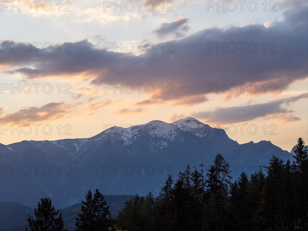 Evening mood after sunset, snow-covered Alpine peaks, Reiting massif, view from the lowlands, Leoben, Styria, Austria, Europe