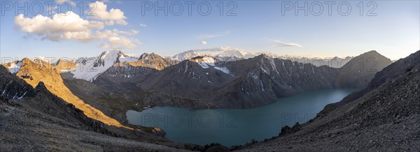 Panorama, turquoise mountain lake Ala Kul Lake, mountain peaks with glaciers glow red at sunset, Ala Kul Pass, Tien Shan Mountains, Kyrgyzstan, Asia