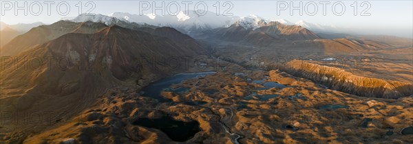 Aerial view, high mountain landscape with glacial moraines and mountain lakes, behind Pik Lenin, Trans Alay Mountains, Pamir Mountains, Osher Province, Kyrgyzstan, Asia