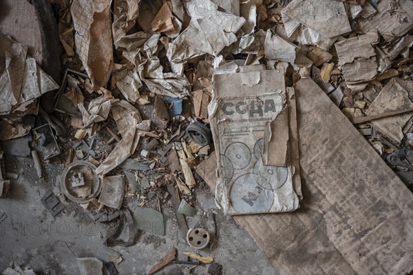 Old newspaper and objects from the USSR, Abandoned ruins, ghost town Enilchek in the Tien Shan Mountains, Ak-Su, Kyrgyzstan, Asia