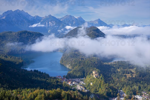 Hohenschwangau Castle, behind it Alpsee and Schwansee in autumn, Romantic Road, Ostallgaeu, Allgaeu, Bavaria, Germany, Europe