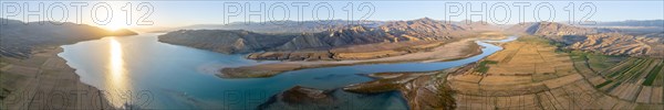 Panorama, River mouth of the Naryn River at Toktogul Reservoir at sunset, aerial view, Kyrgyzstan, Asia