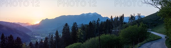 Sunset over mountain peak, Reiting massif, in the valley the village Traboch, panoramic view, view from the lowland, Leoben, Styria, Austria, Europe