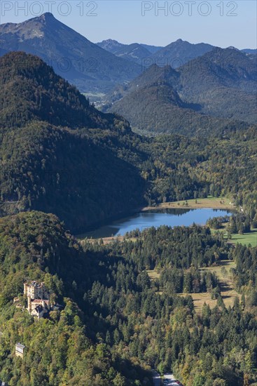 Hohenschwangau Castle and Schwansee in autumn, Romantic Road, Ostallgaeu, Allgaeu, Bavaria, Germany, Europe