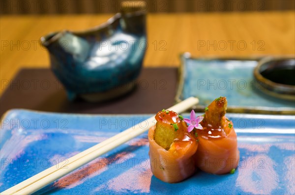 Combined of differents japanese sushi on a elegant blue plate