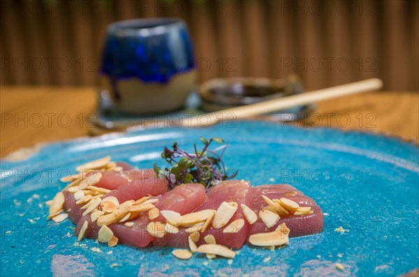 Delicious premium tuna sashimi arranged on an elegant handmade platter