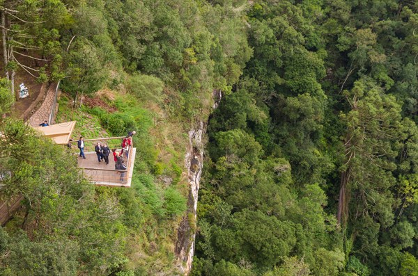 CANELA, BRAZIL, May 12, 2019. Tourists observing a snail cascade (Cascade of Caracol) in park lookout