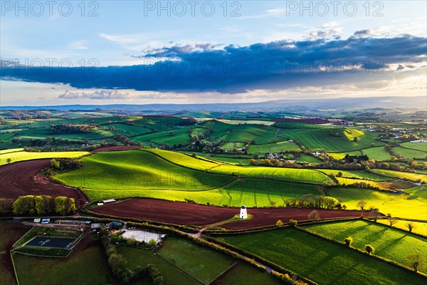 Sunset of Devon Windmill over Fields and Farms from a drone, Torquay, Devon, England, United Kingdom, Europe