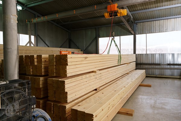 At sawmill. Image of warehouse lined with metal sheets