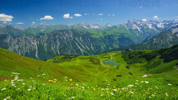 Panorama from the Fellhorn over the Schlappoldsee and mountain station Fellhornbahn to the central main ridge of the Allgaeu Alps, Allgaeu, Bavaria, Germanya